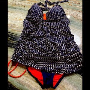 MoonTide of New Zealand, one-piece halter style swimsuit in navy and orange.